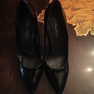 Glossy black pumps